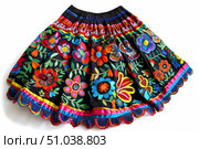 Colorful embroidered mexican skirt with floral design on white background. Стоковое AI-изображение, AI-художник Иван Рябоконь / Фотобанк Лори