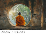 Buddhist monk meditating in ancient temple opening overlooking nature. Стоковое AI-изображение, AI-художник Иван Рябоконь / Фотобанк Лори