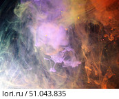 Dissolving paint drops of different colors in water. Red, blue, green, black, purple paint stains in the water. Стоковое фото, фотограф Олег Тараканов / Фотобанк Лори
