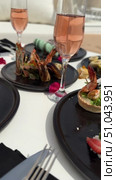 Grilled salmon steak with crispy skin sauteed vegetables and lemon served in outdoor restaurant in summer light A wooden table with a variety of dishes containing seafood, vegetables and fruit.Hand holding a spoon ready to eat pineapple fried rice with shrimp, served in a pineapple bowl, surrounded by fresh fruits and tea on a cozy table setting.Party Sea Food platter with salmon and prawns, low angle view, close-up Sea food party platter, extreme Whole poached salmon with cucumber slices for scales, high end party platter, overhead view Tiger prawns on the grill Macarooni cookies floating on blue background, levitation, macarooni cookies, dessert, sweets, colorful, delicious Two Glasses of Pink Champagne with Macarons and Oranges Elegant seaside celebration with seafood, pink floral decor, and sparkling wine overlooking the ocean. Стоковое видео, видеограф Zita Khasanova / Фотобанк Лори