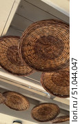 Cozy creative interior of outdoor cafe on beach seacoast. Wooden tables with thatched bamboo chairs and lamps. Summer terrace with rustic wicker chairs nobody. Natural color rattan furniture beach Bar decor rustic straw lamp at the beach patio, bar or shop with blue sky background. Vacation, get away, summer outing concept. Стоковое видео, видеограф Zita Khasanova / Фотобанк Лори