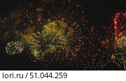 Fireworks bursting brightly in the night sky. Стоковое видео, видеограф Игорь Жоров / Фотобанк Лори