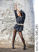 Full length portrait of a young brunette in a formal jacket and black tights. Стоковое фото, фотограф Андрей Аркуша / Фотобанк Лори