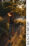 Evening jog through a serene park as the sun sets in the background. Стоковое AI-видео, аниматор Сергей Толмачёв / Фотобанк Лори