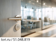 Doorknob. Metal door handle lock and latch of brass on veneer doors. Door wooden half opening through interior bedroom background, selective focus. Modern trends in interior design. Close-up. Стоковое AI-изображение, AI-художник Марина Демидюк / Фотобанк Лори