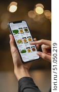 Woman browsing online food delivery menu on smartphone. Стоковое AI-видео, аниматор Юрий Поздников / Фотобанк Лори