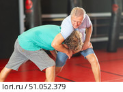 Senior man practicing self-defense techniques in sparring. Стоковое фото, фотограф Яков Филимонов / Фотобанк Лори