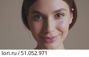 Close-Up Portrait of a Smiling Woman with Natural Beauty and Soft Features, Captured in Two Frames to Highlight Expressive Emotion and Subtle Charm. Стоковое AI-видео, аниматор Владимир Федоров / Фотобанк Лори