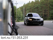 KRASNOYARSK, RUSSIA - July 31, 2025: Black BMW M5 E60. Редакционное фото, фотограф Плотников Дмитрий / Фотобанк Лори