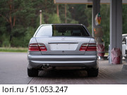 KRASNOYARSK, RUSSIA - July 31, 2025: Silver Mercedes Benz E class W210. Редакционное фото, фотограф Плотников Дмитрий / Фотобанк Лори