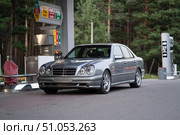 KRASNOYARSK, RUSSIA - July 31, 2025: Silver Mercedes Benz E class W210. Редакционное фото, фотограф Плотников Дмитрий / Фотобанк Лори