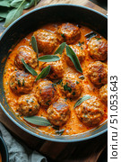Homemade Meatballs Simmered in Rich Tomato Sauce With Fresh Herbs and Spices. Стоковое AI-изображение, AI-художник Юлия Гапеенко / Фотобанк Лори