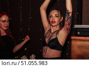 Dancing Queen Glows Amidst Lights in a Nightclub (2021 год). Редакционное фото, фотограф Aleksandr Golubev / Фотобанк Лори