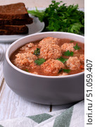 Soup with haddock fish balls in a gray bowl on white table. Стоковое фото, фотограф Оксана Чаюн / Фотобанк Лори