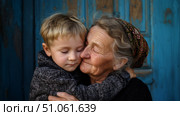 Бабушка обнимает внука. Grandma hugs her grandson. Стоковое AI-изображение, AI-художник Смирнова Светлана / Фотобанк Лори