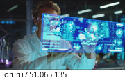 Scientist conducts advanced research in high-tech laboratory with holographic displays. Стоковое AI-видео, аниматор Сергей Толмачёв / Фотобанк Лори