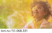 A curious child in safety goggles gazes at a chemical reaction on a bright day. Стоковое AI-видео, аниматор Данила Большаков / Фотобанк Лори