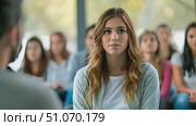 A diverse group of individuals are seated in a room, engaged in conversation and activities. Стоковое AI-видео, аниматор Данила Большаков / Фотобанк Лори