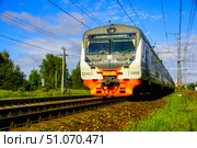 A commuter train is moving along the rails. Russia. Moscow oblast. 14.08. 2025. Редакционное фото, фотограф Ярославский Максим / Фотобанк Лори