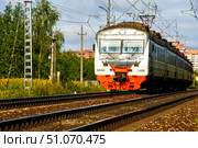 A train is traveling down the tracks with a ladder on the side. Russia. Moscow oblast. 14.08. 2025. Редакционное фото, фотограф Ярославский Максим / Фотобанк Лори