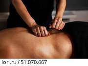 Experience Tranquility Through a Soothing Massage in a Serene Indoor Environment for Relaxation. Стоковое фото, фотограф Aleksandr Golubev / Фотобанк Лори