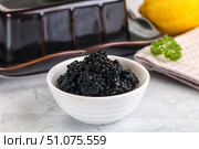 black sturgeon caviar in the bowl. Стоковое фото, фотограф Андрей Старостин / Фотобанк Лори