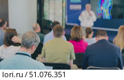 Audience attending a presentation in a modern business training seminar. Стоковое видео, видеограф Антон Гвоздиков / Фотобанк Лори