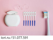 Electric toothbrush, dental floss, brush for cleaning interdental spaces on pink background. Стоковое фото, фотограф Ветерцовская Галина Валериевна / Фотобанк Лори