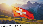 A Swiss flag waves proudly in the foreground, set against a backdrop of majestic mountains and lush green hills, symbolizing Swiss National Day. Стоковое AI-видео, аниматор Nart / Фотобанк Лори