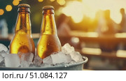 Three glass bottles of beer in a bucket filled with ice. The background features a warm sunset and blurred people enjoying a gathering. Стоковое AI-видео, аниматор Nart / Фотобанк Лори