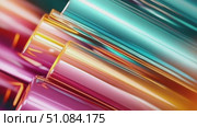 Colorful abstract background with shiny metallic tubes in vibrant hues of pink, blue, and orange. The design creates a dynamic and modern visual effect. Стоковое AI-видео, аниматор Nart / Фотобанк Лори