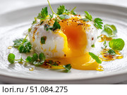Poached egg on a white background. Close up of Eggs Benedict with liquid egg yolk running out. healthy breakfast. Close-up, macro. High key, studio. Delicious eggs served on a plate with fresh herbs. Стоковое AI-изображение, AI-художник Марина Демидюк / Фотобанк Лори