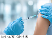 Child receiving a vaccination. Little boy in face mask in doctor's office is vaccinated. Kid giving injection shot. Syringe with covid-19, coronavirus, flu vaccine. Dangerous infectious disease, MPOX. Стоковое AI-изображение, AI-художник Марина Демидюк / Фотобанк Лори