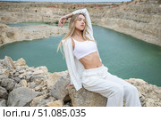 Fashion portrait of young beautiful woman posing in quarry. Стоковое фото, фотограф Андрей Аркуша / Фотобанк Лори