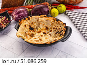 Indian stuffed potato bread Paratha. Стоковое фото, фотограф Андрей Старостин / Фотобанк Лори