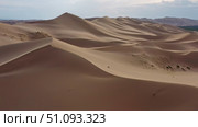 Aerial view of sand dunes in desert at sunset. Стоковое фото, фотограф Михаил Коханчиков / Фотобанк Лори