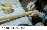 carpenter using nail gun or brad nailer tool on wood box in a workshop ,furniture restoration woodworking concept. selective focus. Стоковое фото, фотограф Feruza Tashmetova / Фотобанк Лори