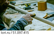 carpenter using nail gun or brad nailer tool on wood box in a workshop ,furniture restoration woodworking concept. selective focus. Стоковое фото, фотограф Feruza Tashmetova / Фотобанк Лори