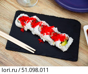 Sushi roll uramaki - tobiko roll with salmon, avocado, pepino, tobiko. Стоковое фото, фотограф Яков Филимонов / Фотобанк Лори