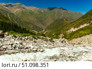 Ala-Archa, Mountain tourism destination. Trekking trails, alpine climbing routes, backcountry hiking, mountaineering base, flowing river, rocky slopes, green forests, and panoramic highland scenery. Стоковое фото, фотограф Андрей Ка / Фотобанк Лори