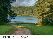 View of Lake Malenets from the foot of the Mikhailovskoye estate of the Pushkin Museum-Reserve on a sunny summer day, Pushkinskiye Gory, Pskov Oblast, Russia. Стоковое фото, фотограф Ula Ulachka / Фотобанк Лори