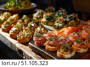 Variety of tasty appetizers with different toppings being served for guests during a catered event. Стоковое AI-изображение, AI-художник Иван Рябоконь / Фотобанк Лори