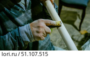 carpenter using nail gun or brad nailer tool on wood box in a workshop ,furniture restoration woodworking concept. selective focus. Стоковое фото, фотограф Feruza Tashmetova / Фотобанк Лори