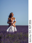 Mother Daughter Lavender. Woman embraces girl in lavender field on sunny day for family portrait. Стоковое фото, фотограф svetograph / Фотобанк Лори