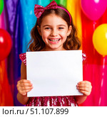 Cute happy girl in a festive dress with a smile on her face on a colorful background. Holding a white sheet of paper. Стоковое AI-изображение, AI-художник Ирина Гильмуллина / Фотобанк Лори