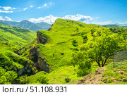 Picturesque mountain view of green slope and deep rocky gorge. North Caucasus. Стоковое фото, фотограф Константин Лабунский / Фотобанк Лори