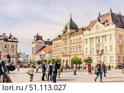 A panoramic city view of Novi Sad with its iconic bridge over the Danube River is a breathtaking sight. From this vantage point, the city sprawls beneath the sky, with the elegant Varadin Bridge connecting the two sides of the river. Стоковое фото, фотограф Feruza Tashmetova / Фотобанк Лори