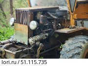 An old rusty homemade tractor. Industrial or agrotechnical equipment. Стоковое фото, фотограф Наталия Кирсанова / Фотобанк Лори