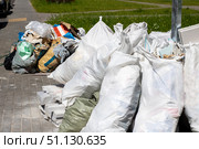 Numerous Piles of Waste Bags Have Been Collected for Proper Disposal. Стоковое фото, фотограф Аксенова Вера / Фотобанк Лори