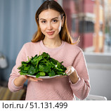Portrait of a positive young woman with a plate of spinach. Стоковое фото, фотограф Яков Филимонов / Фотобанк Лори